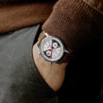 A Breitling Watch on the wrist of a hand.