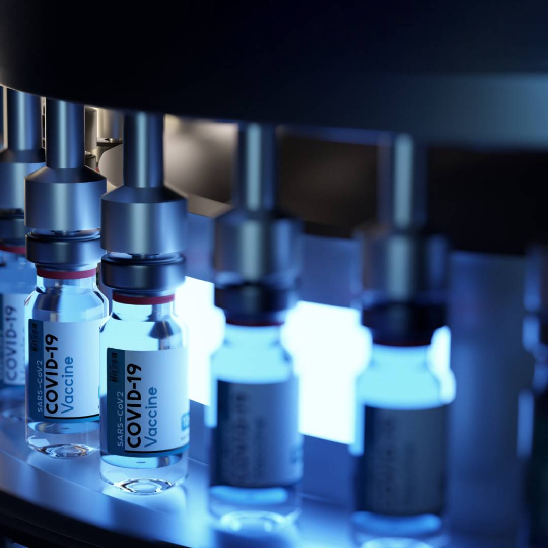 Pfizer BioNTech vaccines bottles being filled.